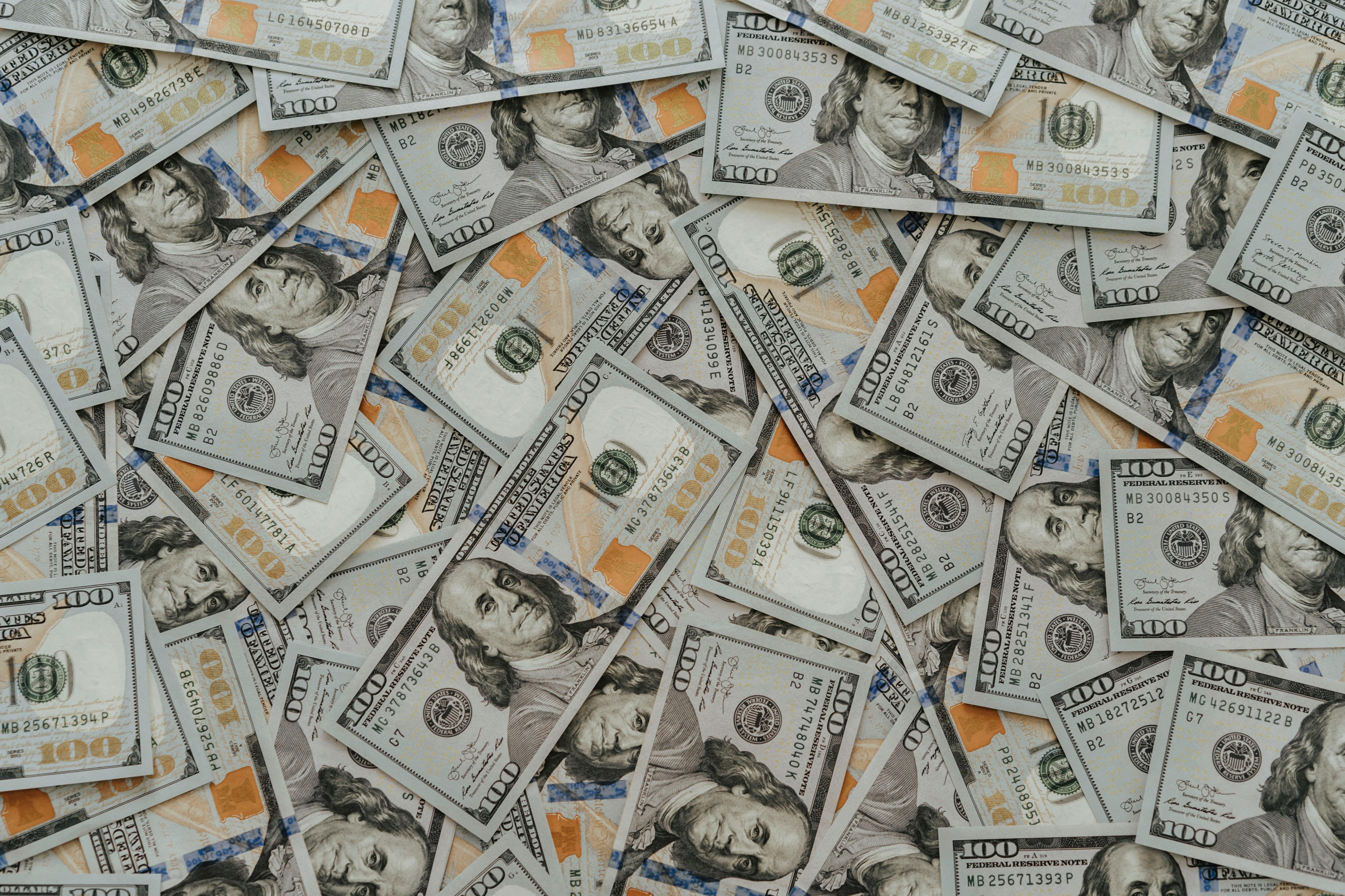 Scattered one hundred dollar bills